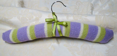Image of our finished Striped Coat Hanger Cover knitting pattern